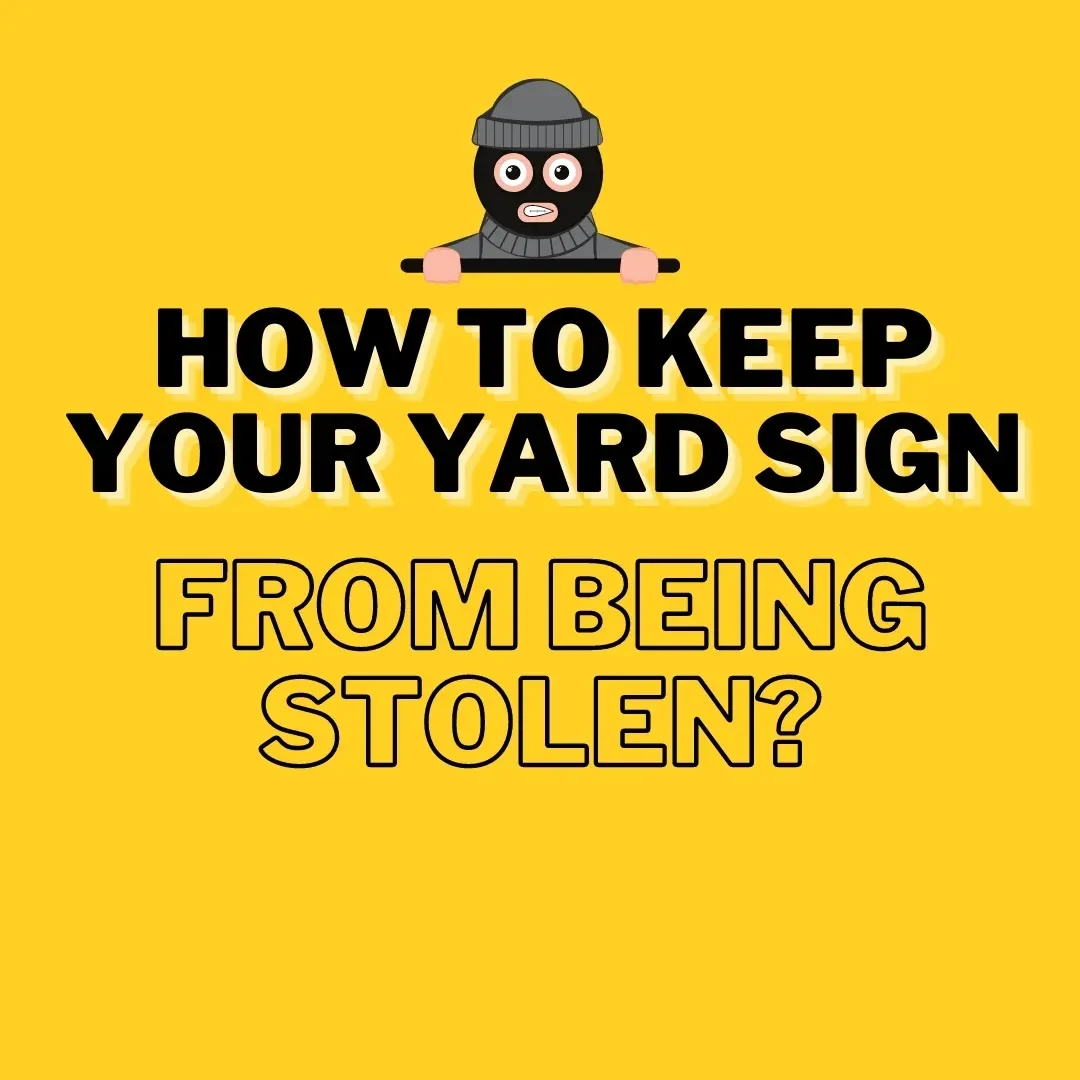 A securely placed yard sign staked firmly into the ground with zip ties, positioned in a well-lit area to prevent theft